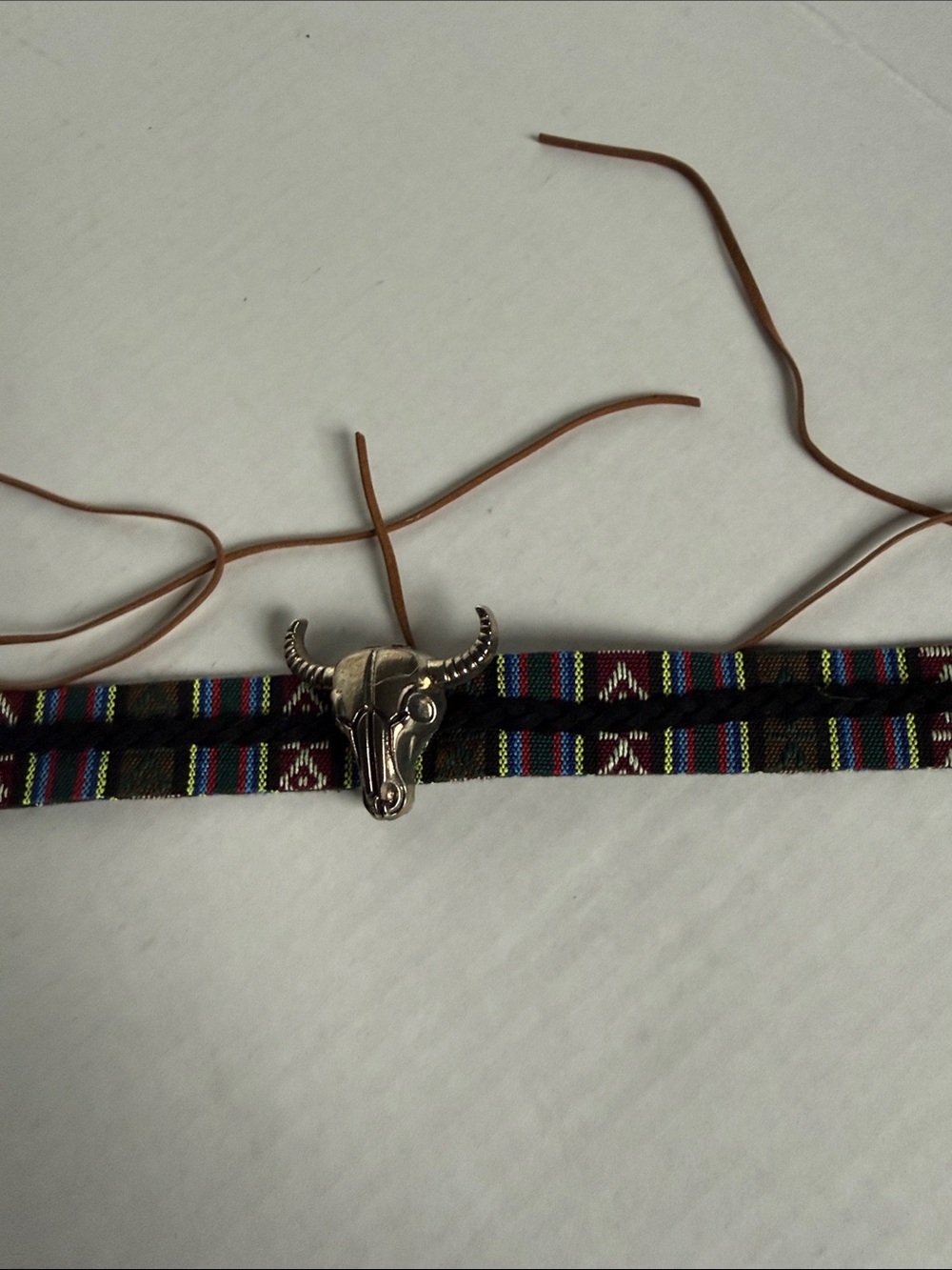 Brown Southwestern Pattern hat accessory 
with Silver Bull Skull Accent